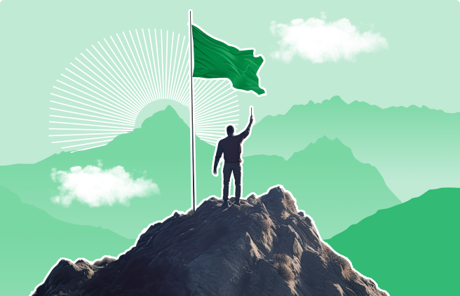 Hombre en la cima de una montaña con una bandera verde